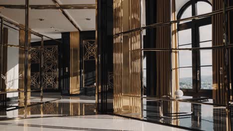 golden sunlight streams through large windows and geometric brass screens into a luxurious art deco interior, creating an atmosphere of timeless elegance