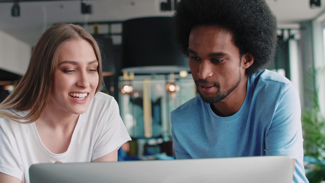 Young couple working with technology in the office