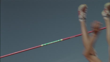 a man completes a high jump