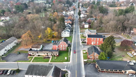 Aerial-pullback-reveal-reverse-dolly-shot-of-American-community-in-USA-during-late-autumn-fall