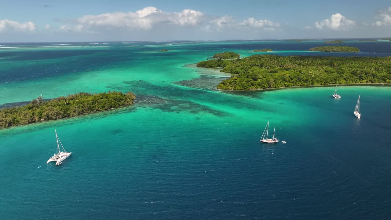Stunning Aerial View Of Tropical Islands In Vava'u With Boats Anchoring In Tonga. approaching, wide shot