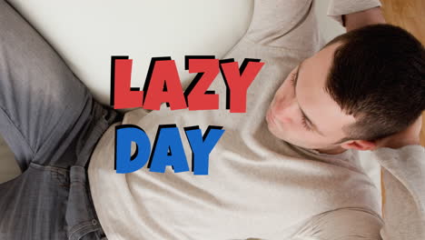 animation of lazy day text over caucasian man lying