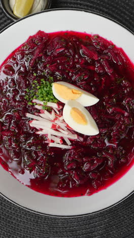 borscht soup with eggs and radishes