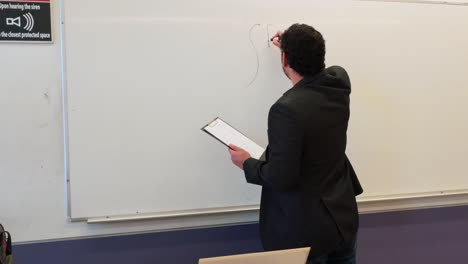 focused educator preparing his lesson plan