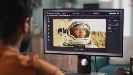 person editing video of a woman in a spacesuit