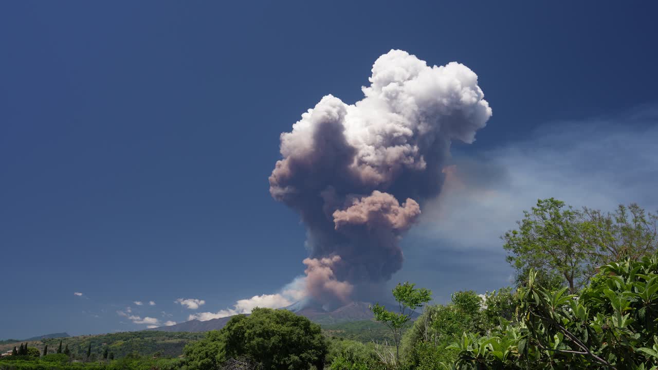 Active volcano Mt. Etna eruption and releasing a big brown cloud after a part of the caldera collapded, June 2025 , Sicily, Italy