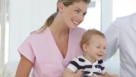 nurse and doctor with a baby