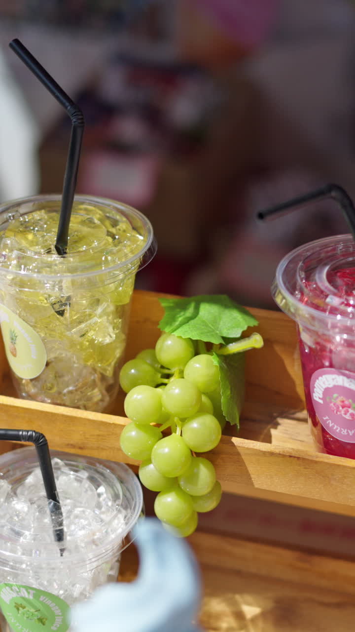 Close up of different beverages for sale on display at the Tsukiji Fish Market in Japan. Vertical