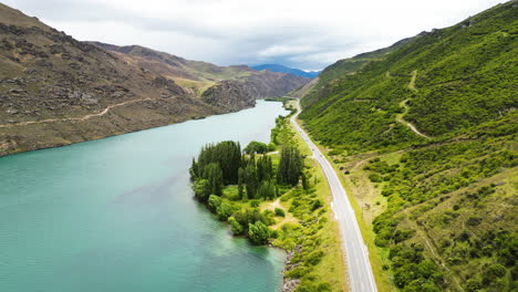 Aerial-view-on-picturesque-New-Zealand-State-Highway-on-bank-of-Clutha-River
