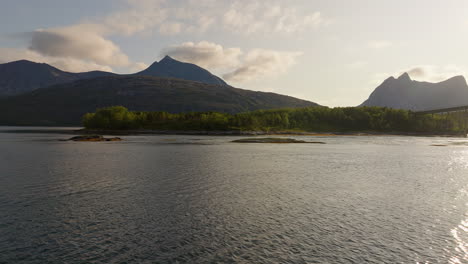 Drone-panoramic,-picturesque-mountain-and-water-scenery,-sunset