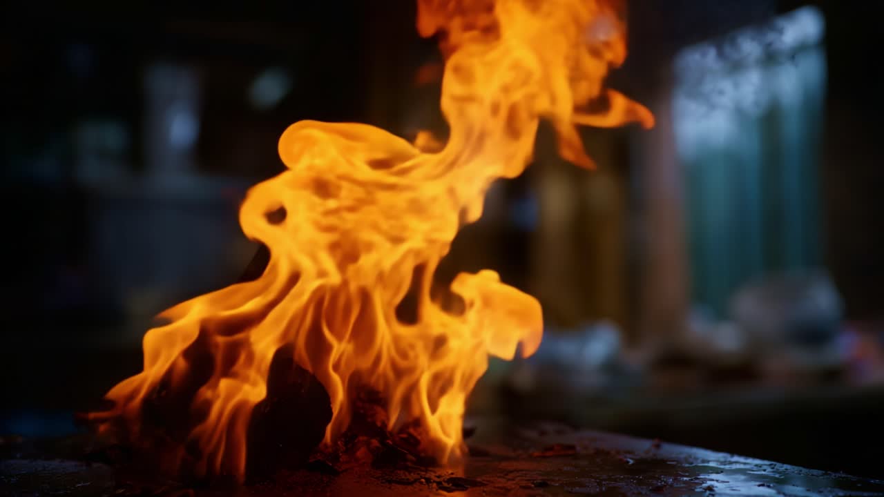 Dramatic Flames Dance: A Captivating Display of Fire's Intensity in a Dimly Lit Environment, Showcasing the Unpredictable Nature of Flame Movement and Color