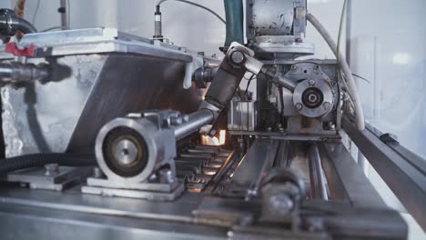 automatic machine for the production of marshmallows. rotating shaft and pistons of an automatic conveyor machine in a confectionery factory