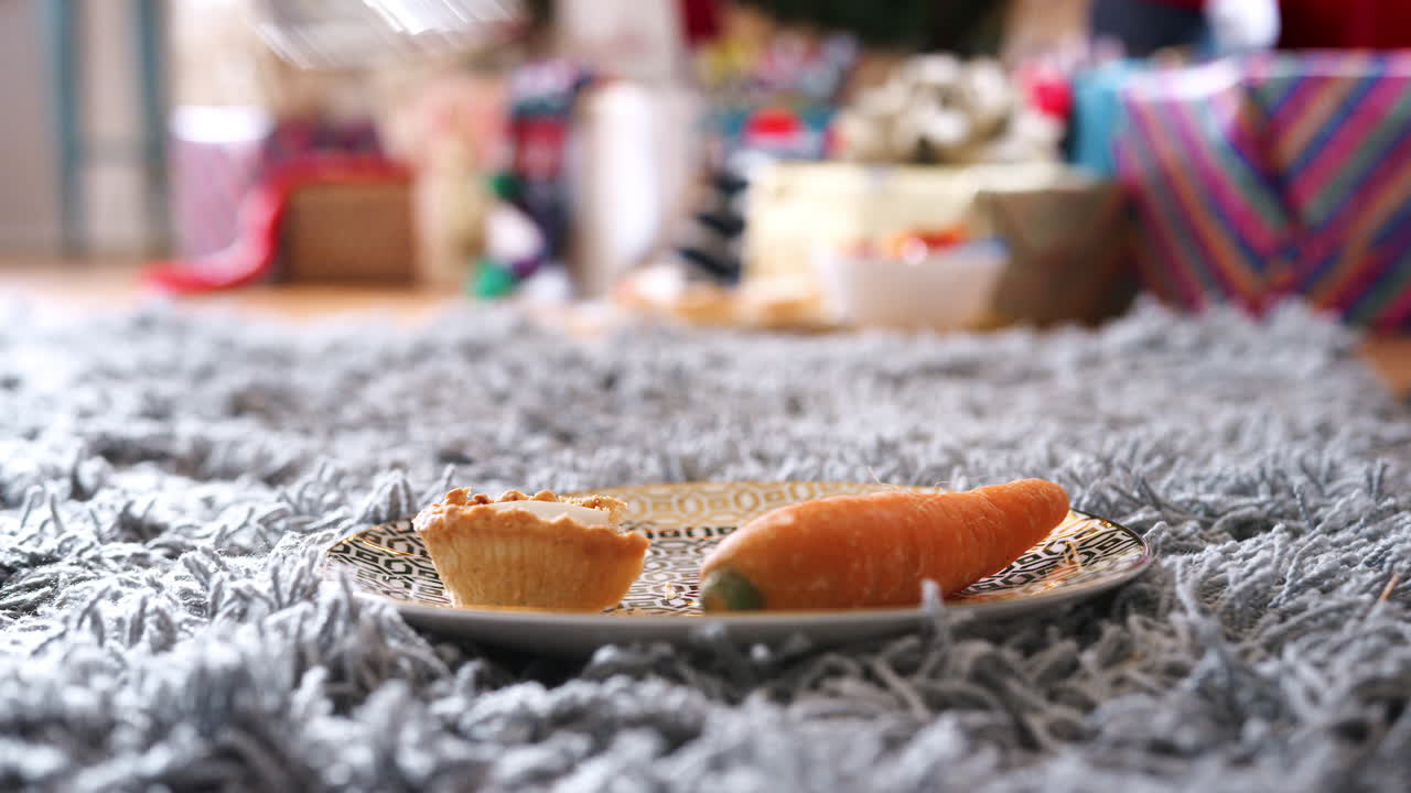 Taking Bite Out Of Mince Pie With Carrot And Glass Of Milk Left Out For Santa On Christmas Eve