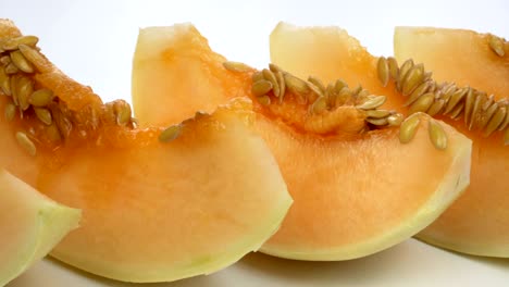 exotic melon fruit close-up. sliced melon on a white background