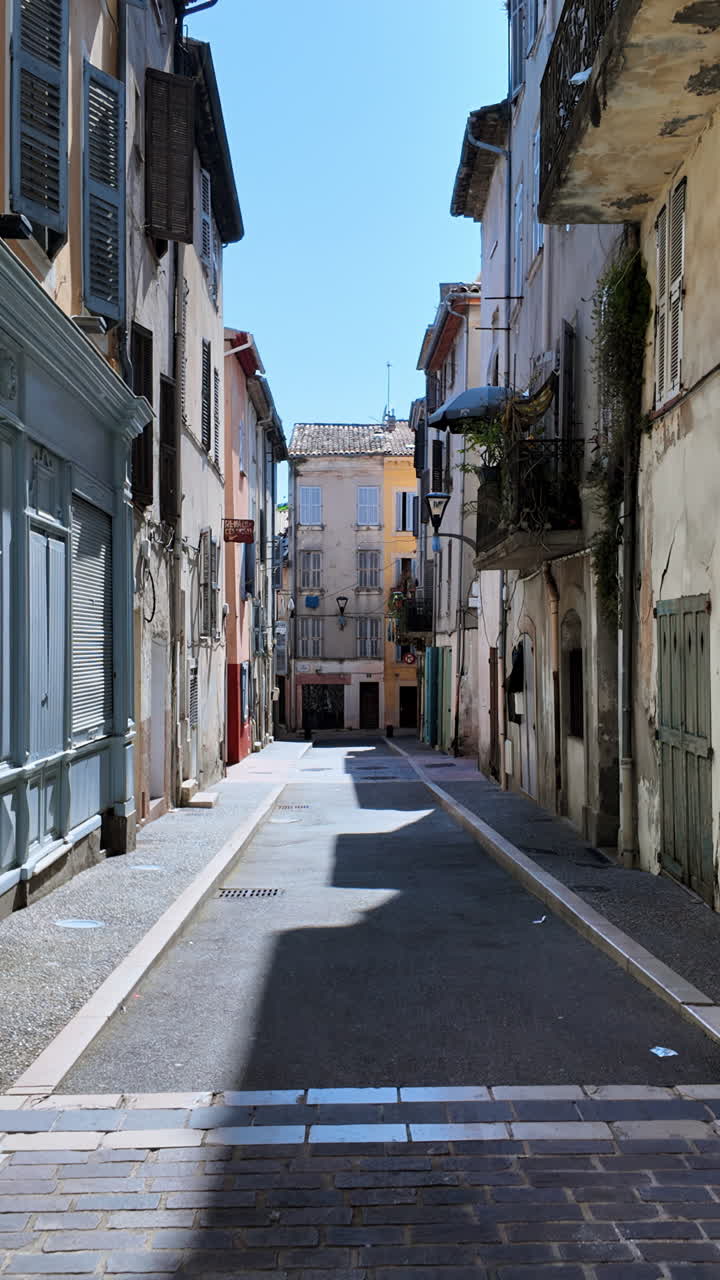 Buildings on sides of the street in Vallauris, France. Vertical