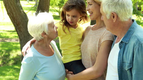 family talking together in park