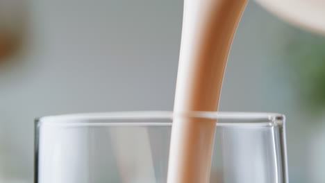 pouring milk into a glass