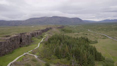 öxarárfoss waterfall in iceland aerial track alongside wall and path