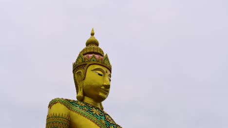 a large buddha’s statue in mahachai towering the sky is a welcome attraction to tourists and worship destination to devotees who are wanting specific blessings.