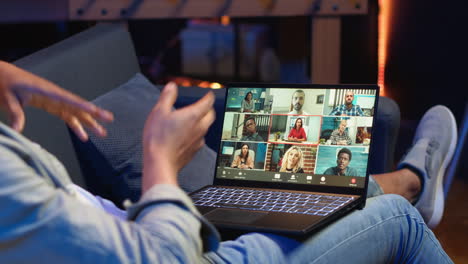 vertical video smiling african american man hosting a virtual family meeting online