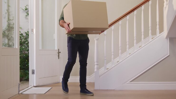 Caucasian attractive man moving into new house