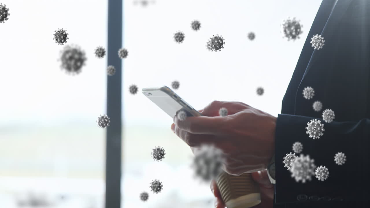 animación de células macro covid-19 flotantes sobre un hombre caucásico usando su teléfono inteligente