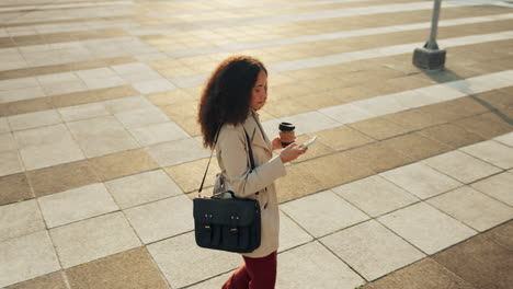 Top-view,-outdoor-and-woman-with-a-cellphone