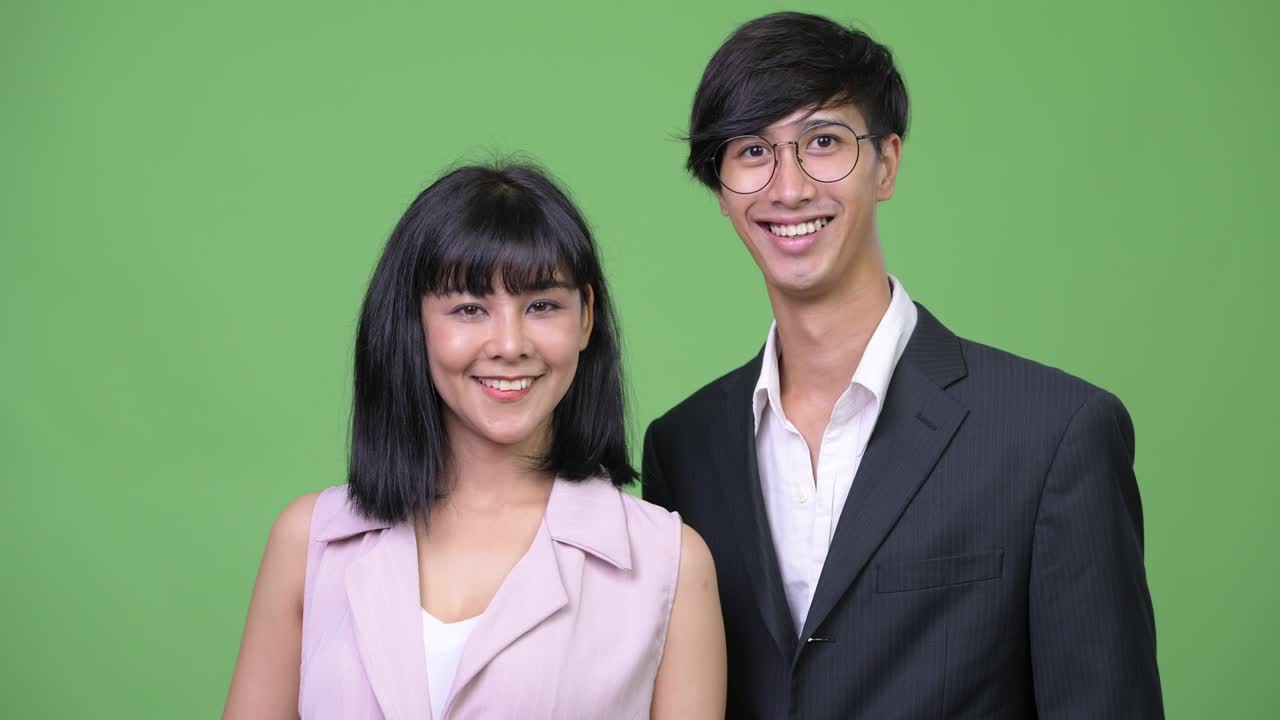 Young happy Asian business couple smiling together | Premium Stock ...