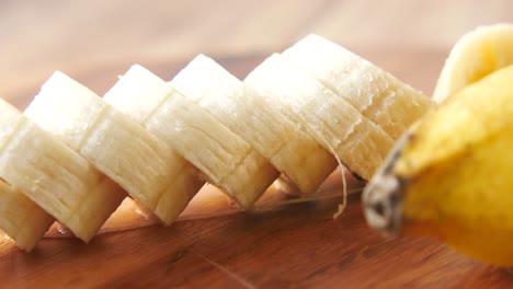 sliced banana on wooden board