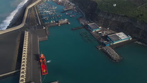 tazacorte harbor on la palma island coast and volcanic cliffs in background