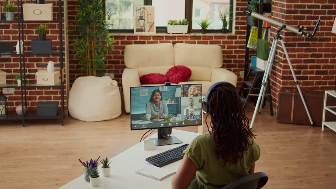 Businesswoman talking to corporate people on online conference