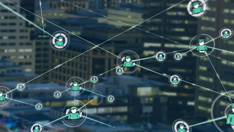 animation of network of profile icons against aerial view of tall buildings