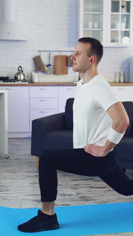 fit training at home. fit man exercising at home in living room