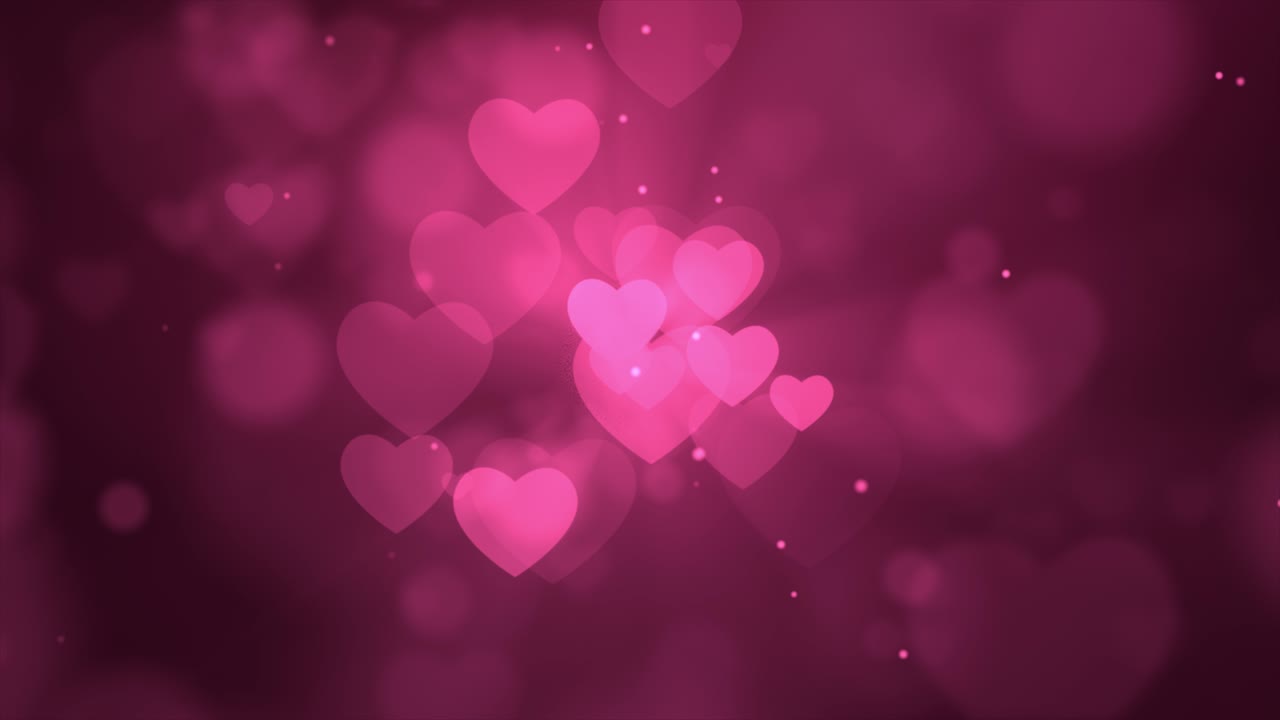 el brillo rosado brilla con luz mágica. el polvo brillante, las partículas de bokeh del corazón, el fondo de bucle 4k.