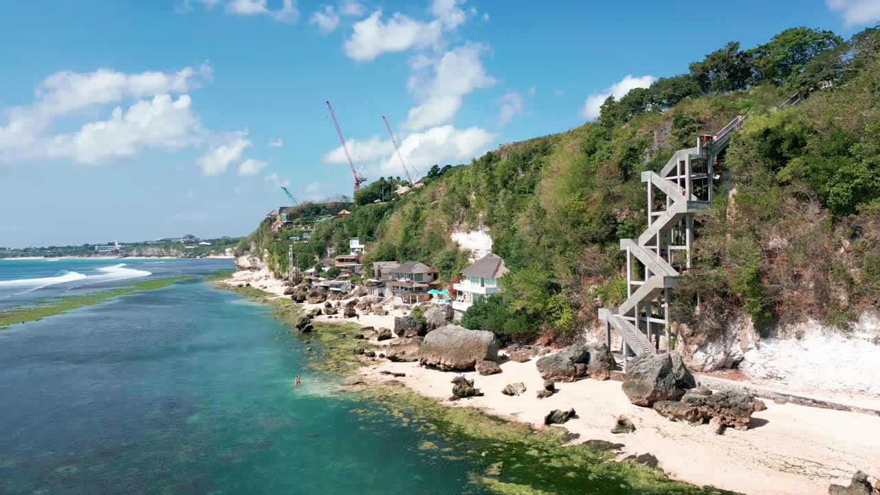 Serene Landscape Of Padang Padang Beach With Rocky Coastal Cliff In Bali, Indonesia. Aerial, wide shot