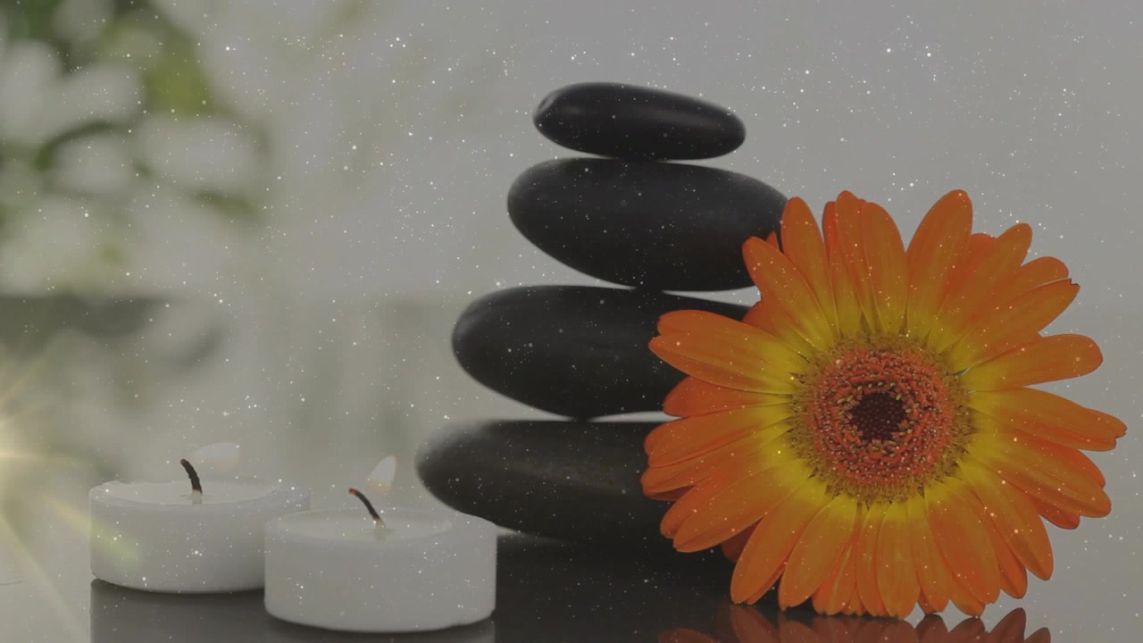 Animation af støv over stearinlys, blomst og massagesten