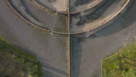 aerial establishing view of the memorial to the holocaust victims near liepaja day, birdseye drone shot moving forward