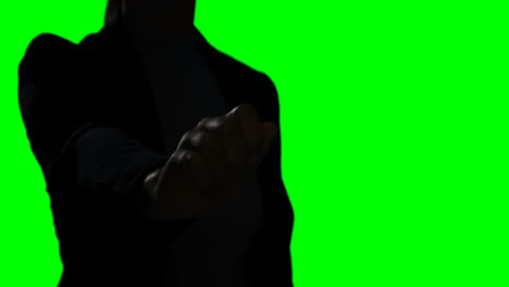 Woman-making-hand-gesture-against-green-screen-background