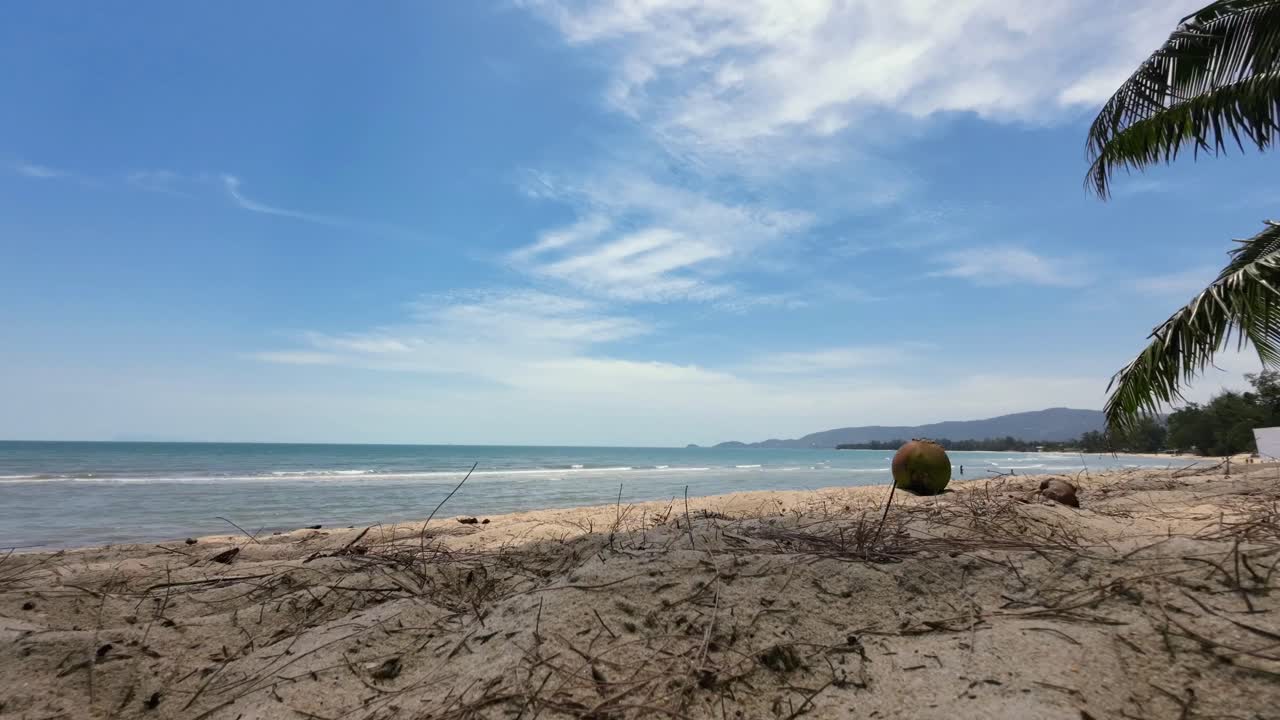 Dynamic time-lapse footage of Lamai Beach, Koh Samui, Thailand, showing tropical palm trees, sandy coastline, and moving clouds over the turquoise sea