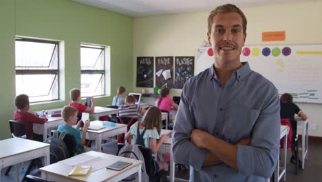 male teacher smiling in the class