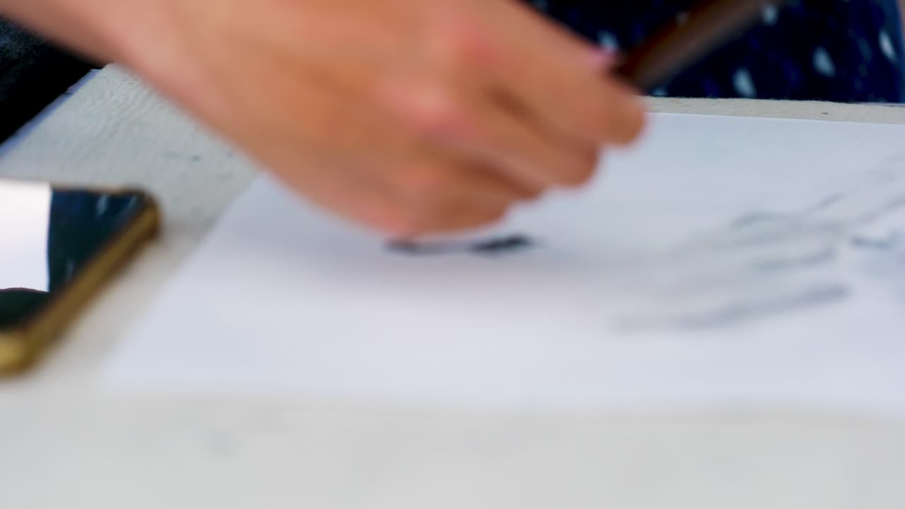 Footage of a Japanese Man Painting a Nihonga, a Traditional Japanese Painting, with Brushes and Black Ink