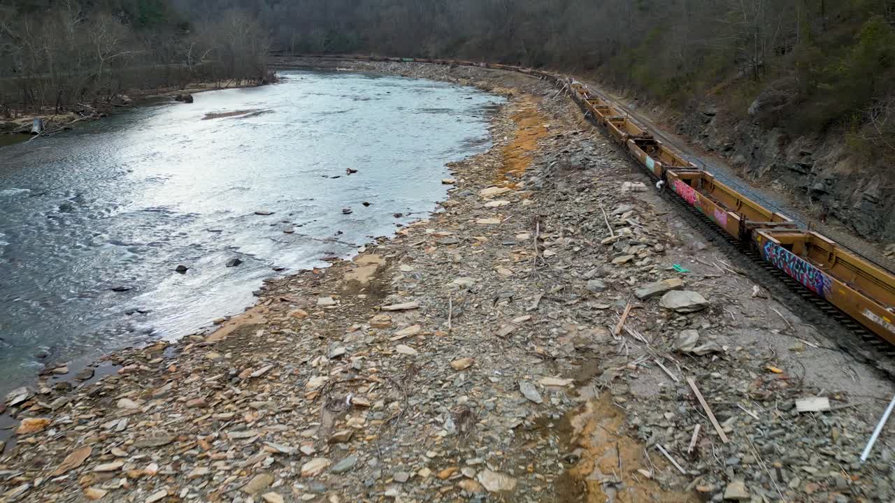 4K Aerial Drone Video of Train Full of PVC Pipes and Debris from Hurricane Helene Stranded on Track Along French Broad River near Marshall, NC (2024)