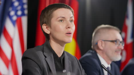 female political leader giving speech at press conference
