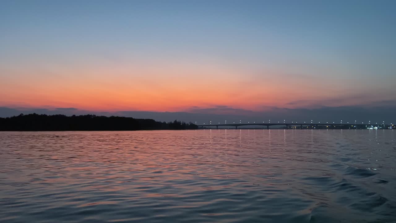 POV From Boat Sailing Across The River At Dusk In Vietnam.