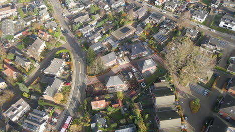 aerial of new houses with solar panels on rooftop in an older suburban neighborhood