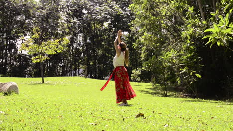 Girl-dances-and-turn-in-circles-in-meditation-with-nature