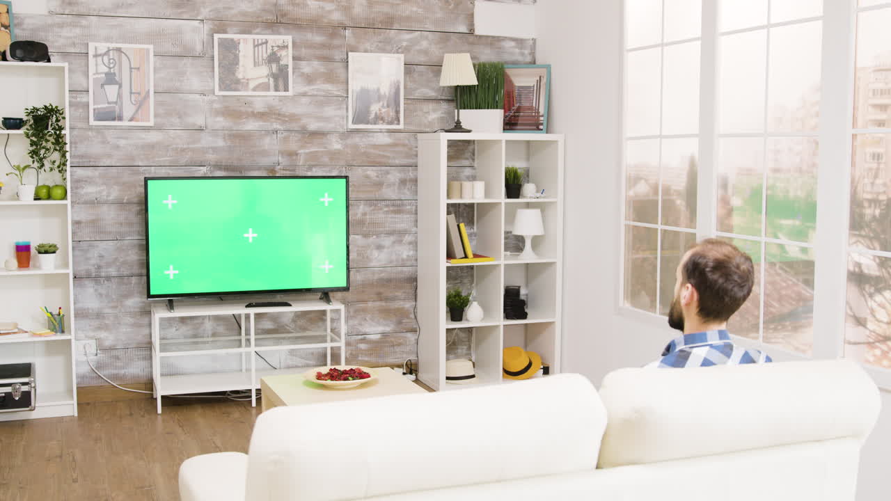Living room with TV and person