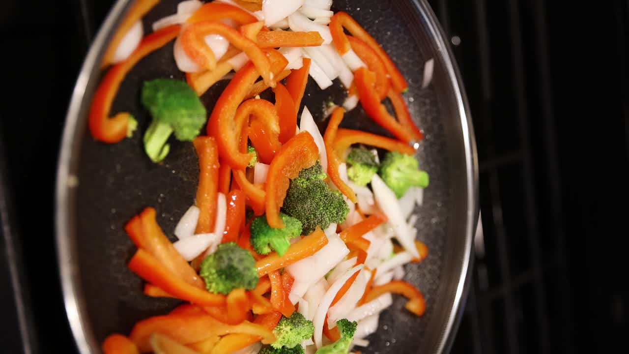 Vertical video, stir fry vegetable with wood spatula concept cook healthy food