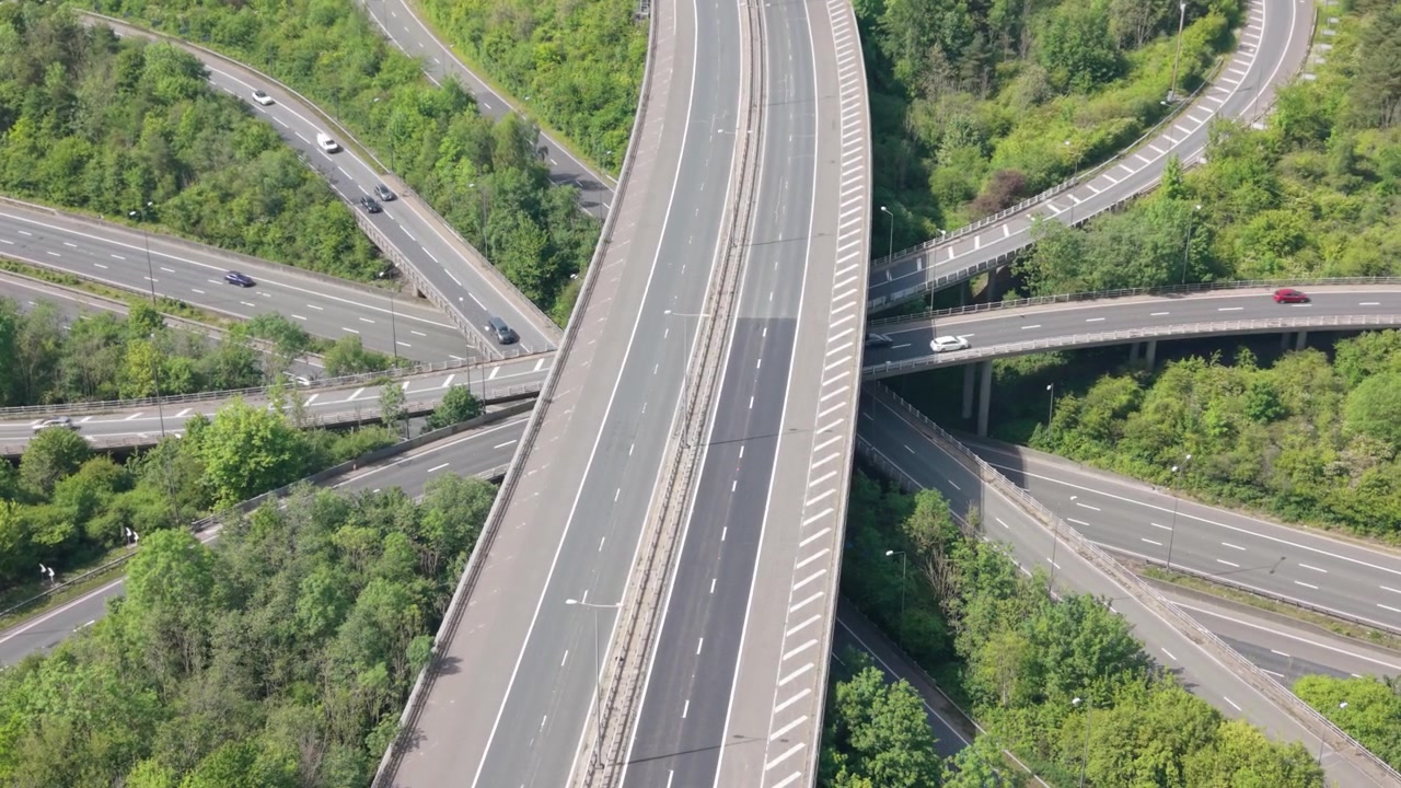 High angle perspective of a multi-lane motorway junction with active traffic.