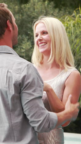 smiling man offering engagement ring